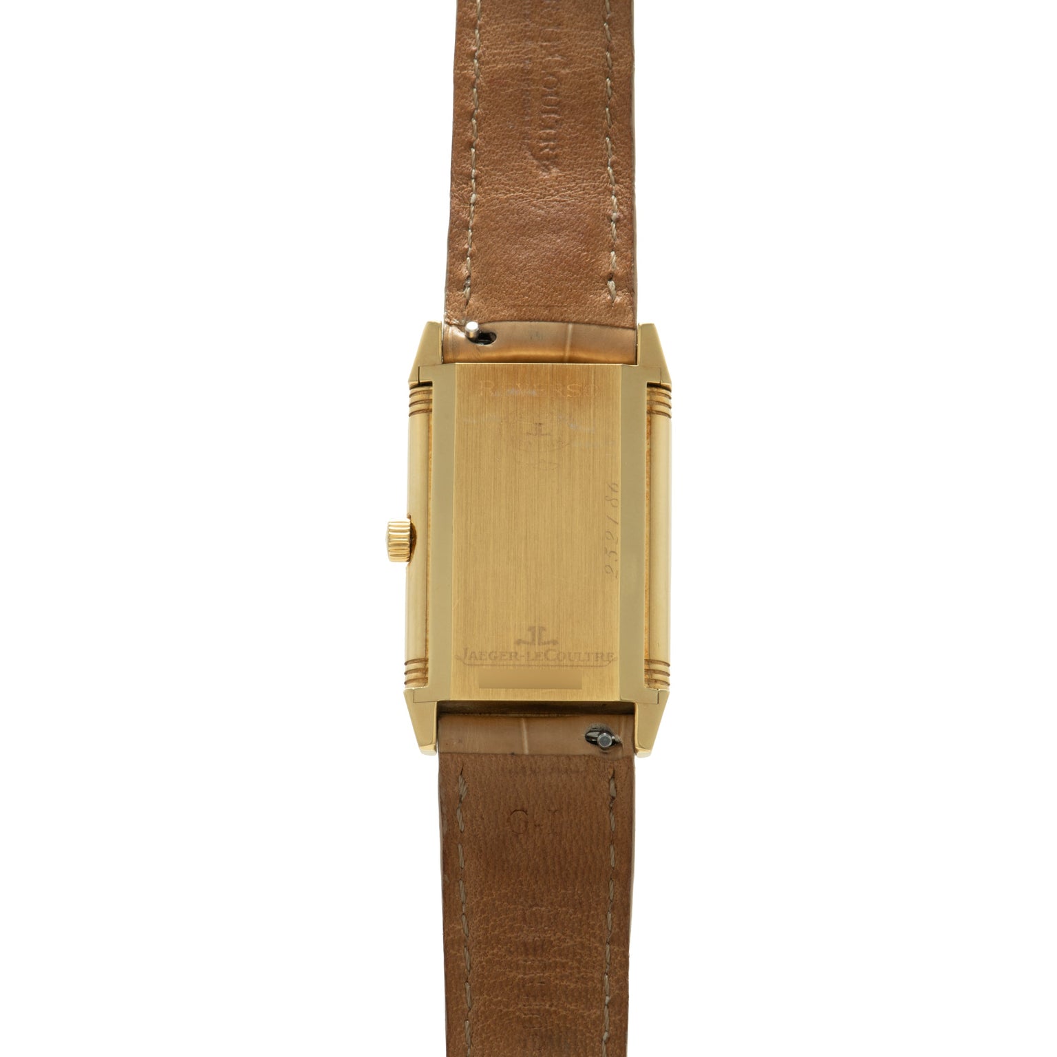 Gold-tone rectangular watch with brushed finish, side crown, and brown leather strap shown from the back.