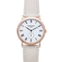 Rose gold watch with white dial, Roman numerals, subdial, and cream leather strap.