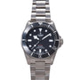 Tudor Pelagos 39 stainless steel diving watch with black dial, white square hour markers, and metal bracelet.