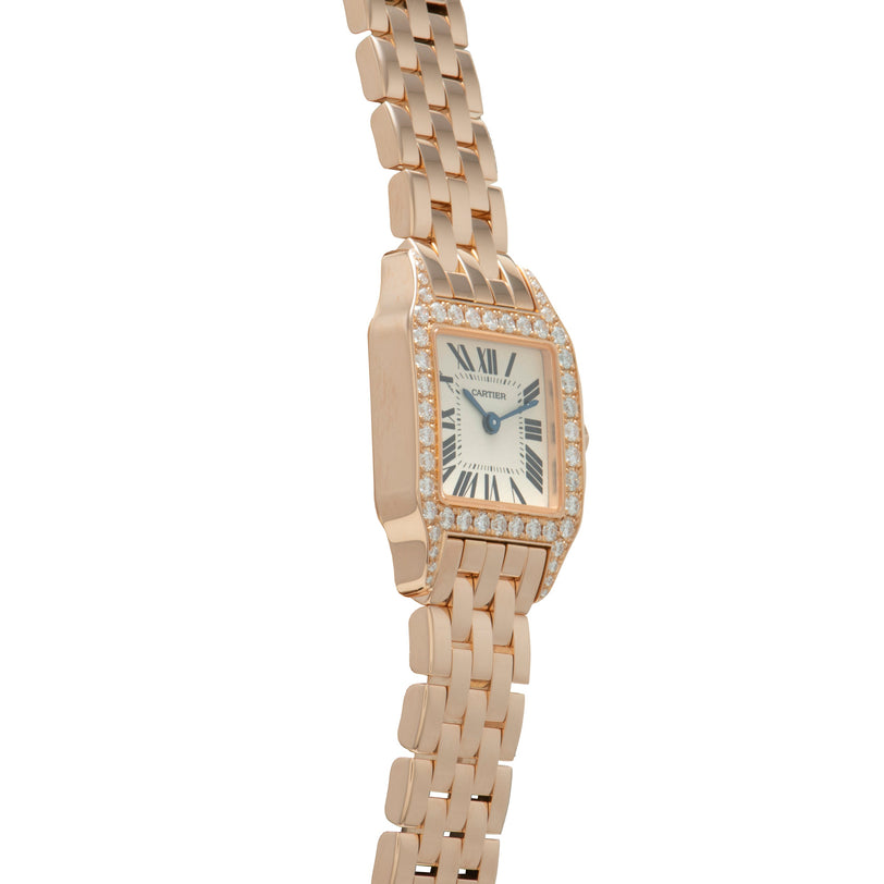 Rose gold rectangular watch with diamond bezel, cream dial with Roman numerals, and matching linked bracelet.