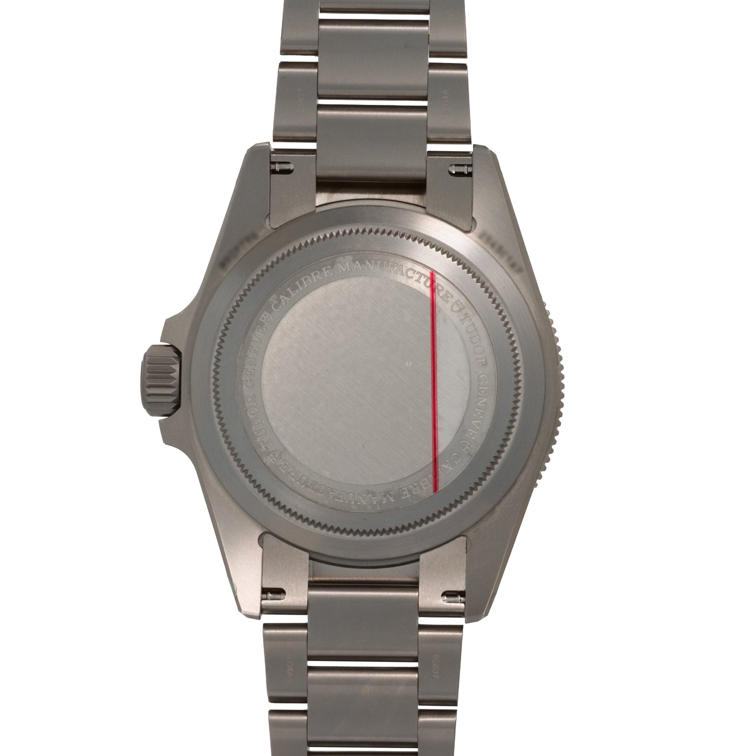 Titanium dive watch with link bracelet shown from the back, displaying brushed caseback with red stripe detail and engraved t