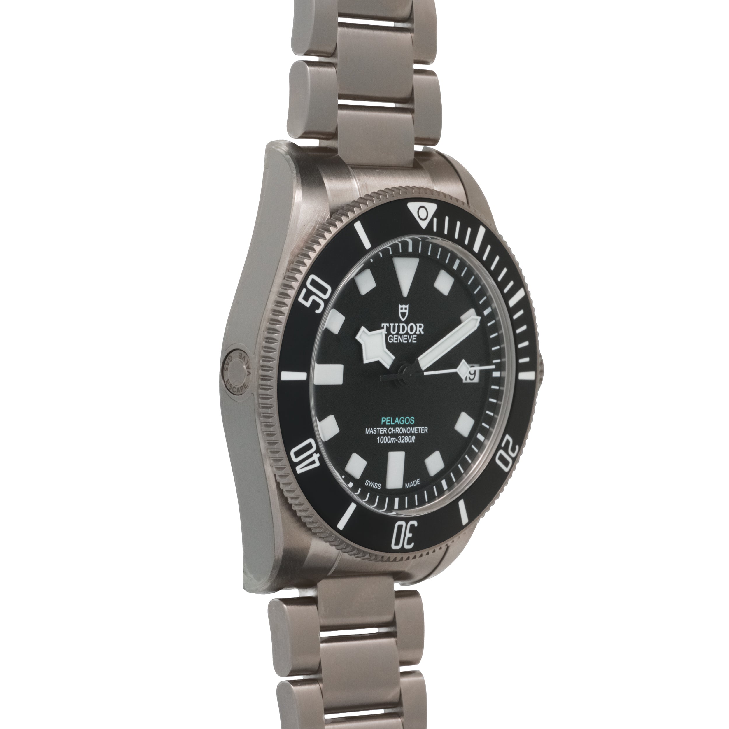 Tudor Pelagos dive watch with titanium case and bracelet, black dial with luminous hour markers and indices, rotating bezel.