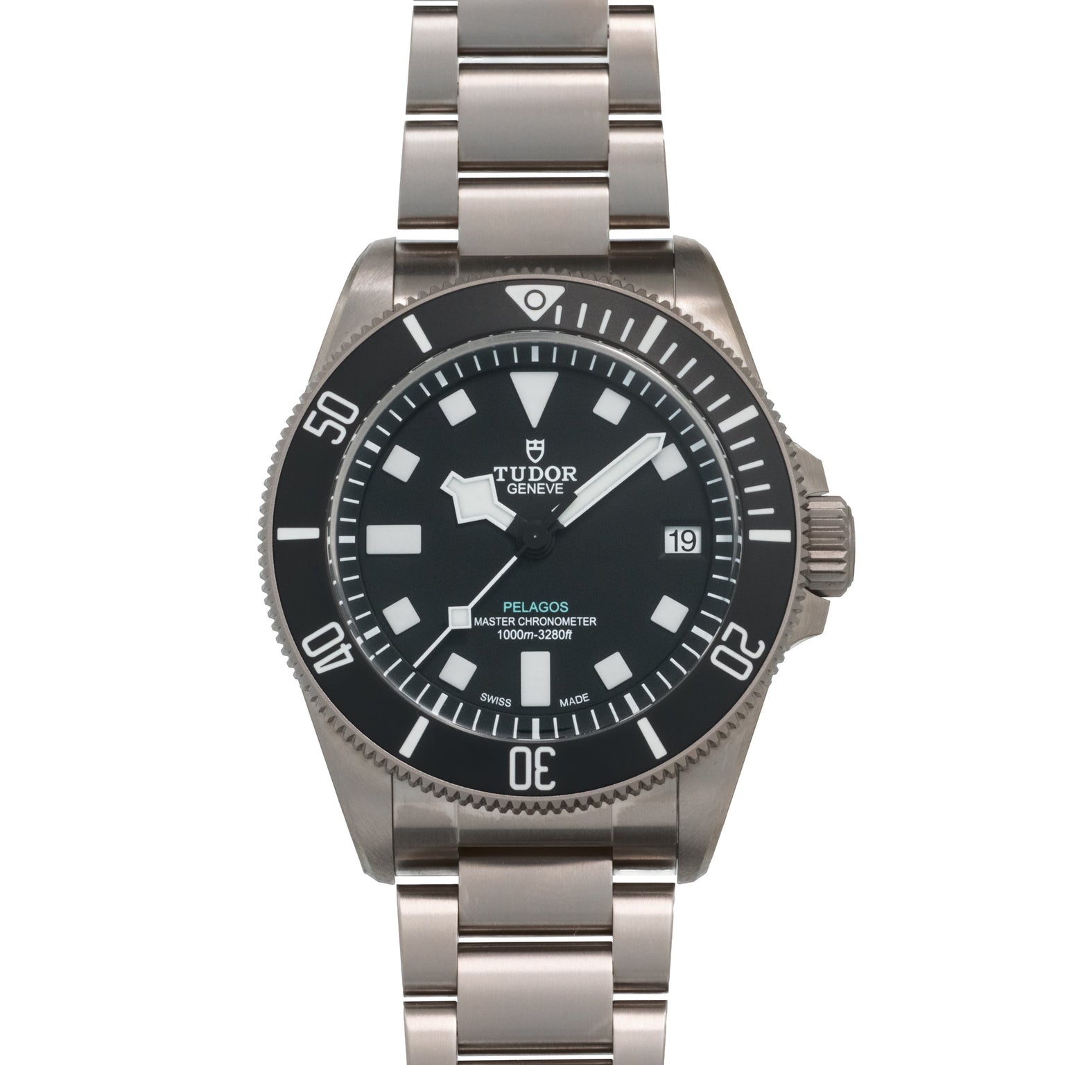 Tudor Pelagos dive watch with black dial, white hour markers, date window, and stainless steel bracelet.