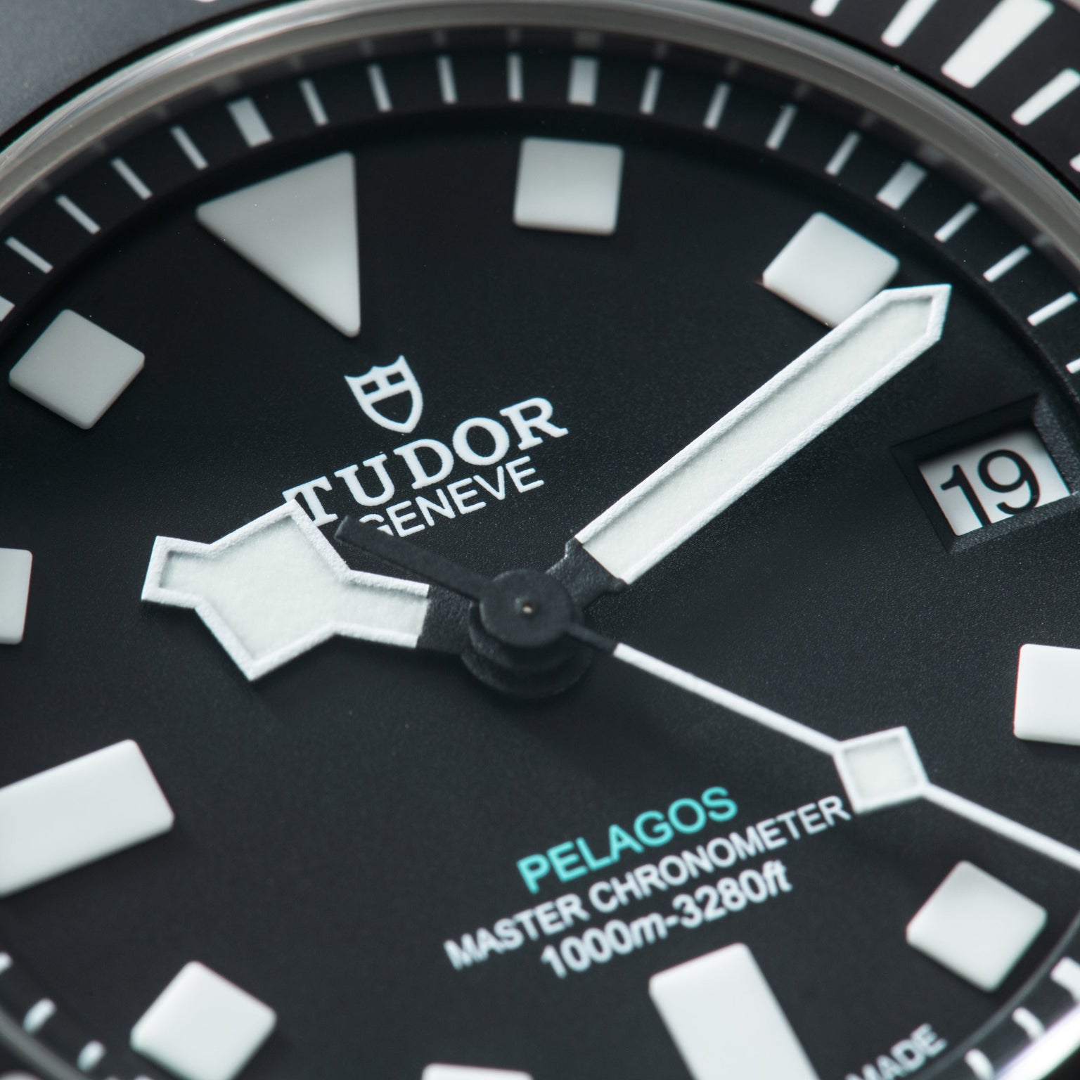 Tudor Pelagos Ultra watch face with black dial, white hour markers, luminous hands, and date window at 3 o'clock.