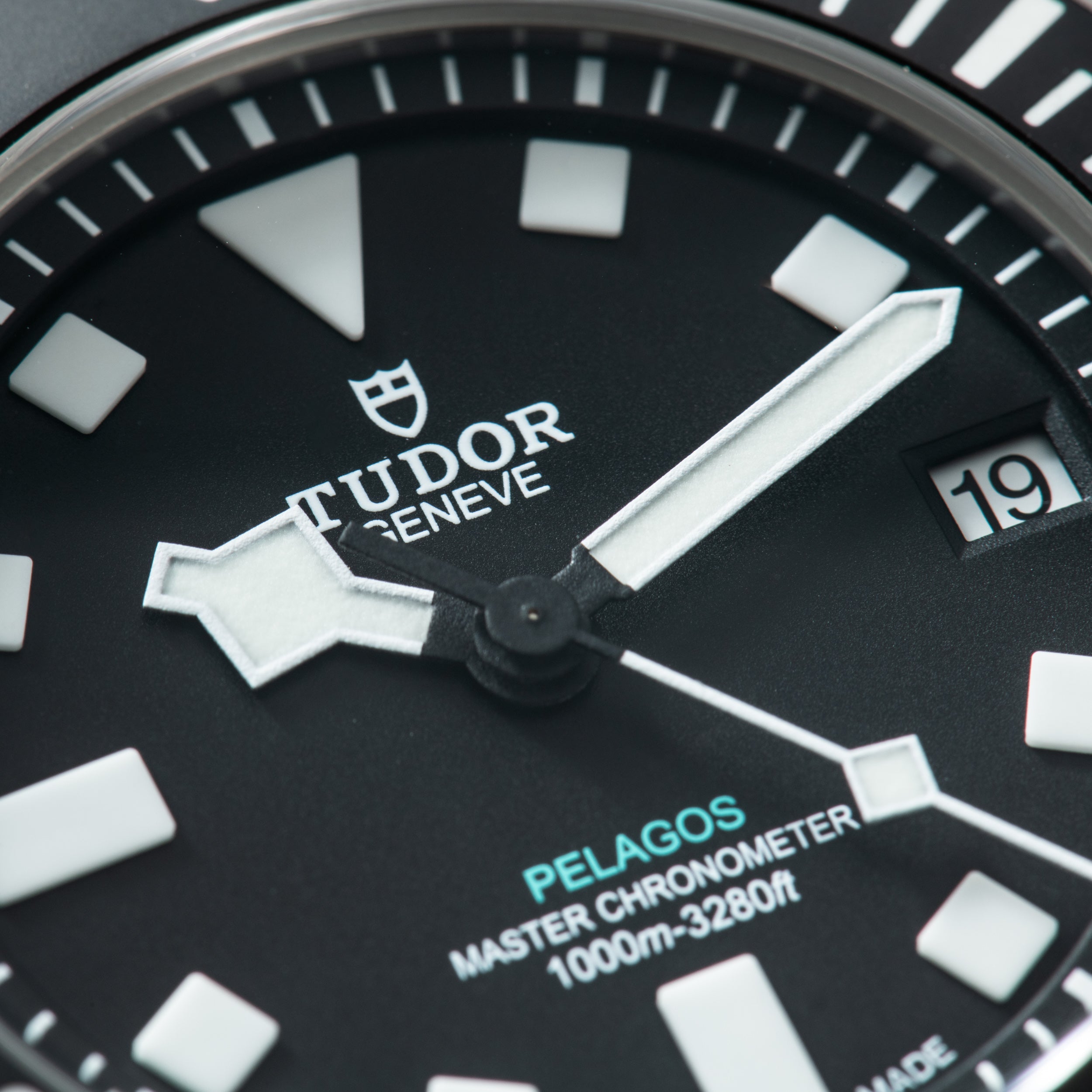 Tudor Pelagos Ultra watch face with black dial, white hour markers, luminous hands, and date window at 3 o'clock.