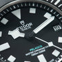 Tudor Pelagos Ultra watch face with black dial, white hour markers, luminous hands, and date window at 3 o'clock.