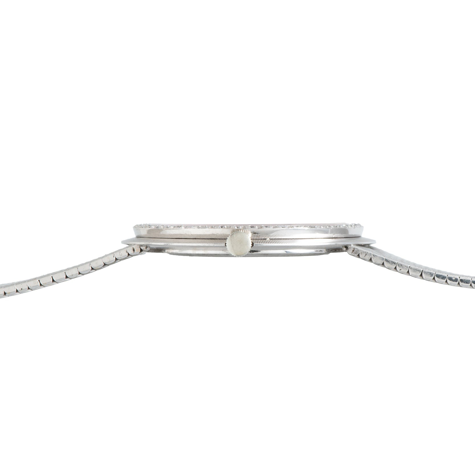 Side view of a thin Vacheron Constantin White Gold Diamond Bezel wristwatch with a metal band and a small crown.