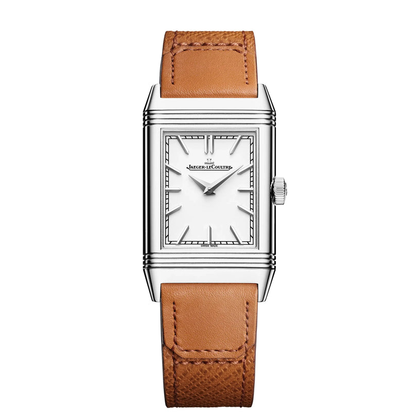The Jaeger-LeCoultre Reverso Tribute Monoface is a rectangular silver watch with a white dial, black hour markers, and an interchangeable brown leather strap. The minimalist design features the Jaeger-LeCoultre name on the face.