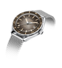 Wristwatch with gray dial and silver mesh band on a white background