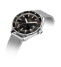 DOXA watch with black dial and silver mesh band on a white background