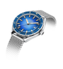 Wristwatch with blue dial and silver mesh band on a white background