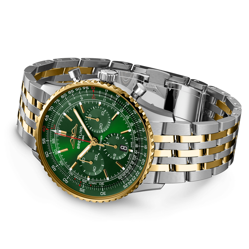 Navitimer B01 chronograph with green dial, yellow gold bezel, and stainless steel two-tone bracelet.