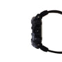 Black digital watch with resin case, textured dial, multiple buttons on side, and black fabric strap.