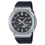 G-Shock stainless steel watch with silver case, black dial, black resin strap, and analog-digital display.