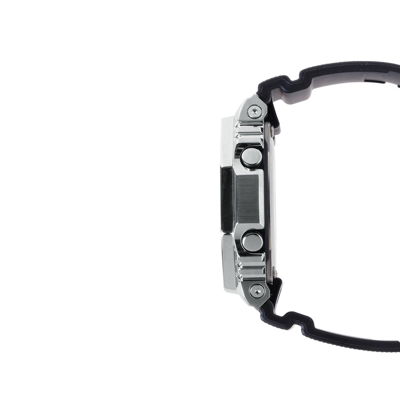 Digital watch with silver stainless steel and black resin case shown from the side profile.