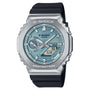 G-SHOCK digital watch with silver stainless steel case, light blue dial, black resin band, and analog/digital display.