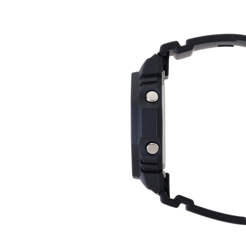 Black resin watch with square case, metal studs, and black band shown from side view.