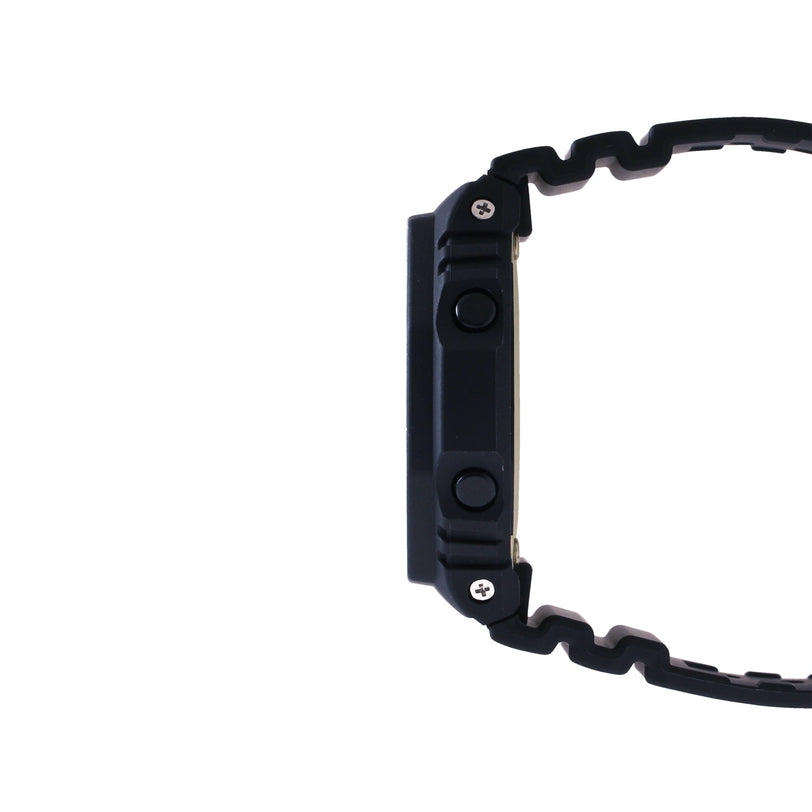 Black resin digital watch with wavy band shown from side view.