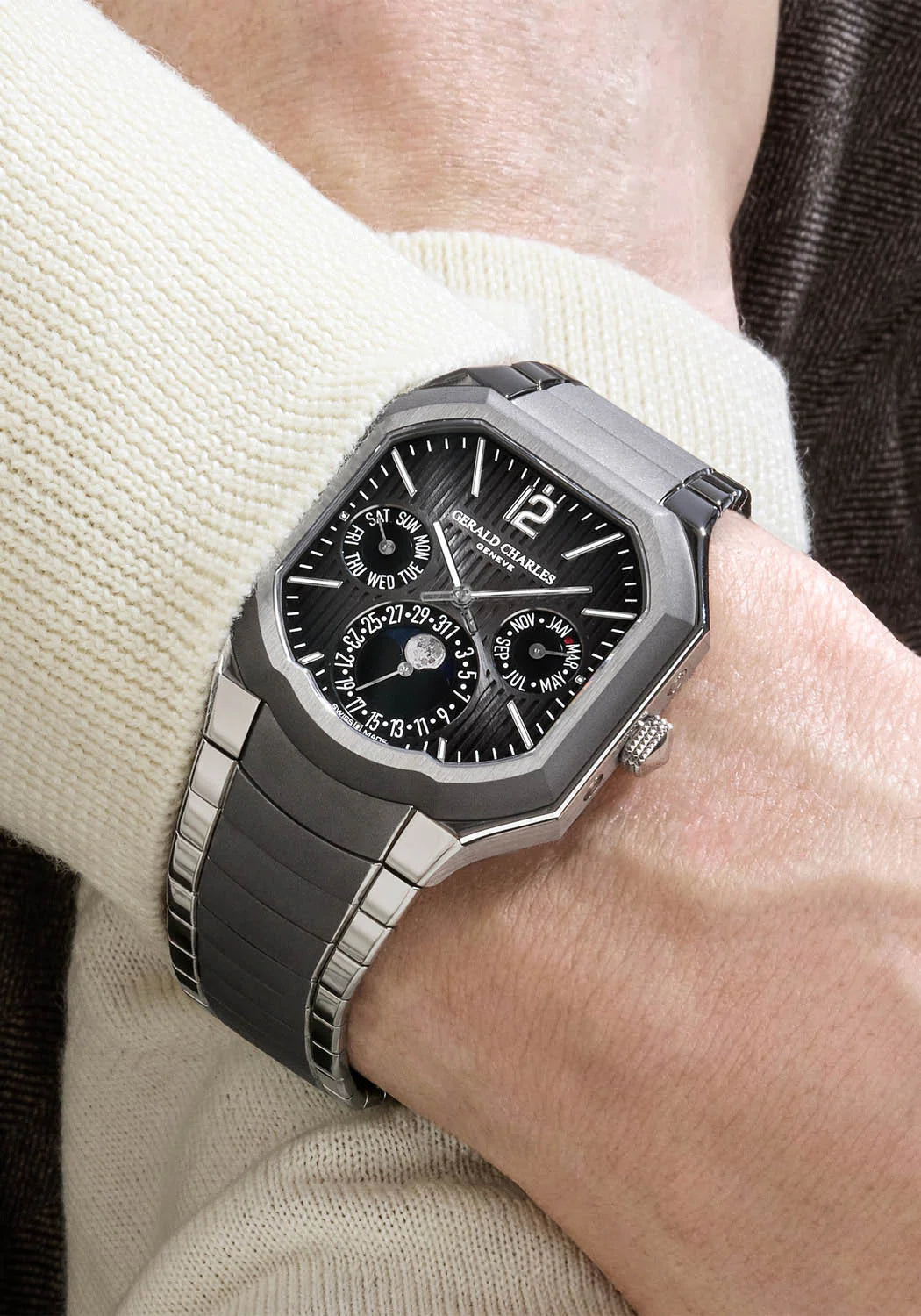 Luxury watch with detailed face on a wrist, brand visible