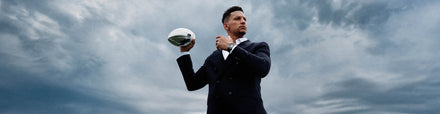 Patrick Mahomes and Hublot watch holding silver footbal