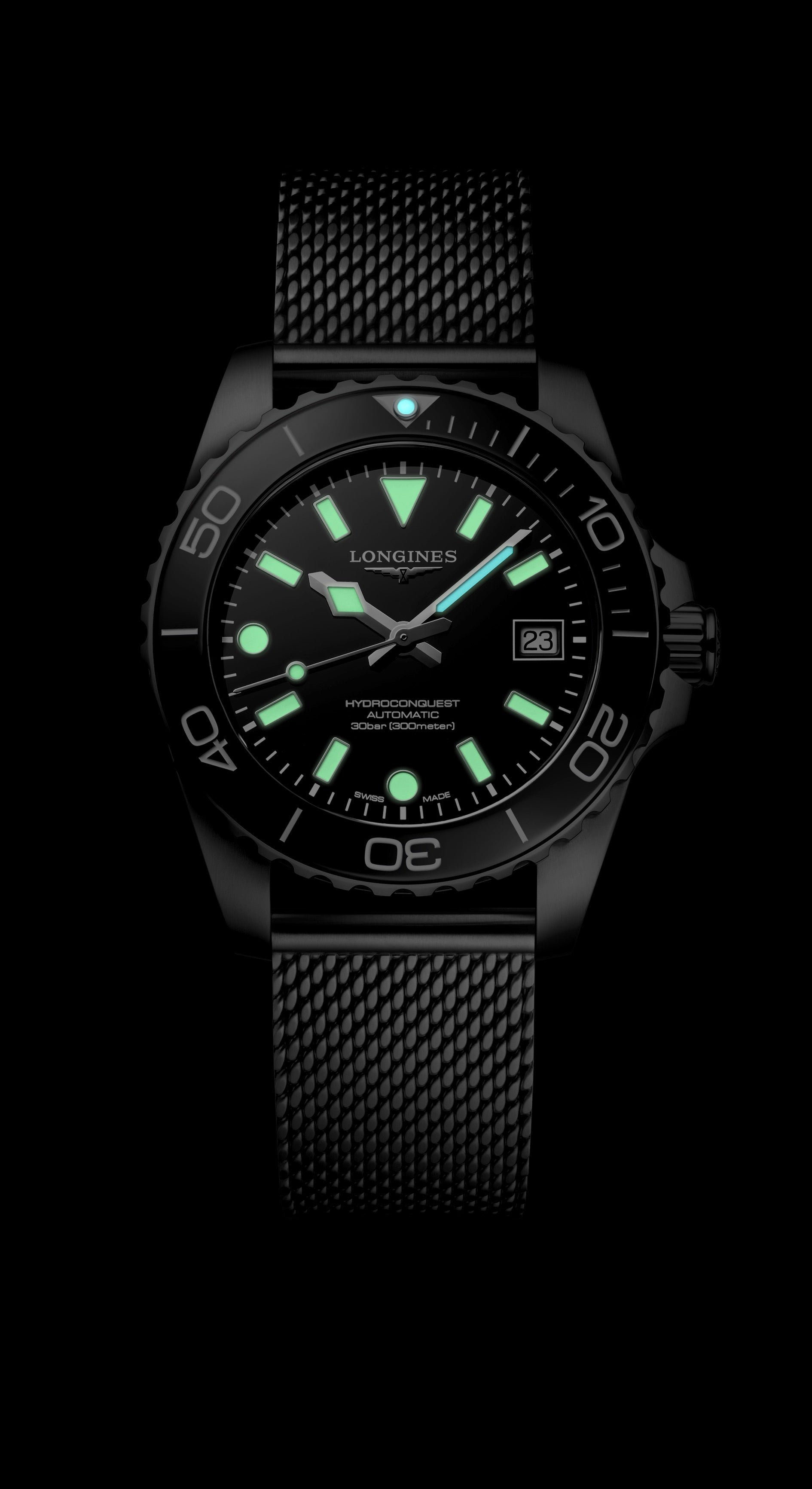 Black wristwatch with glowing face on a black background