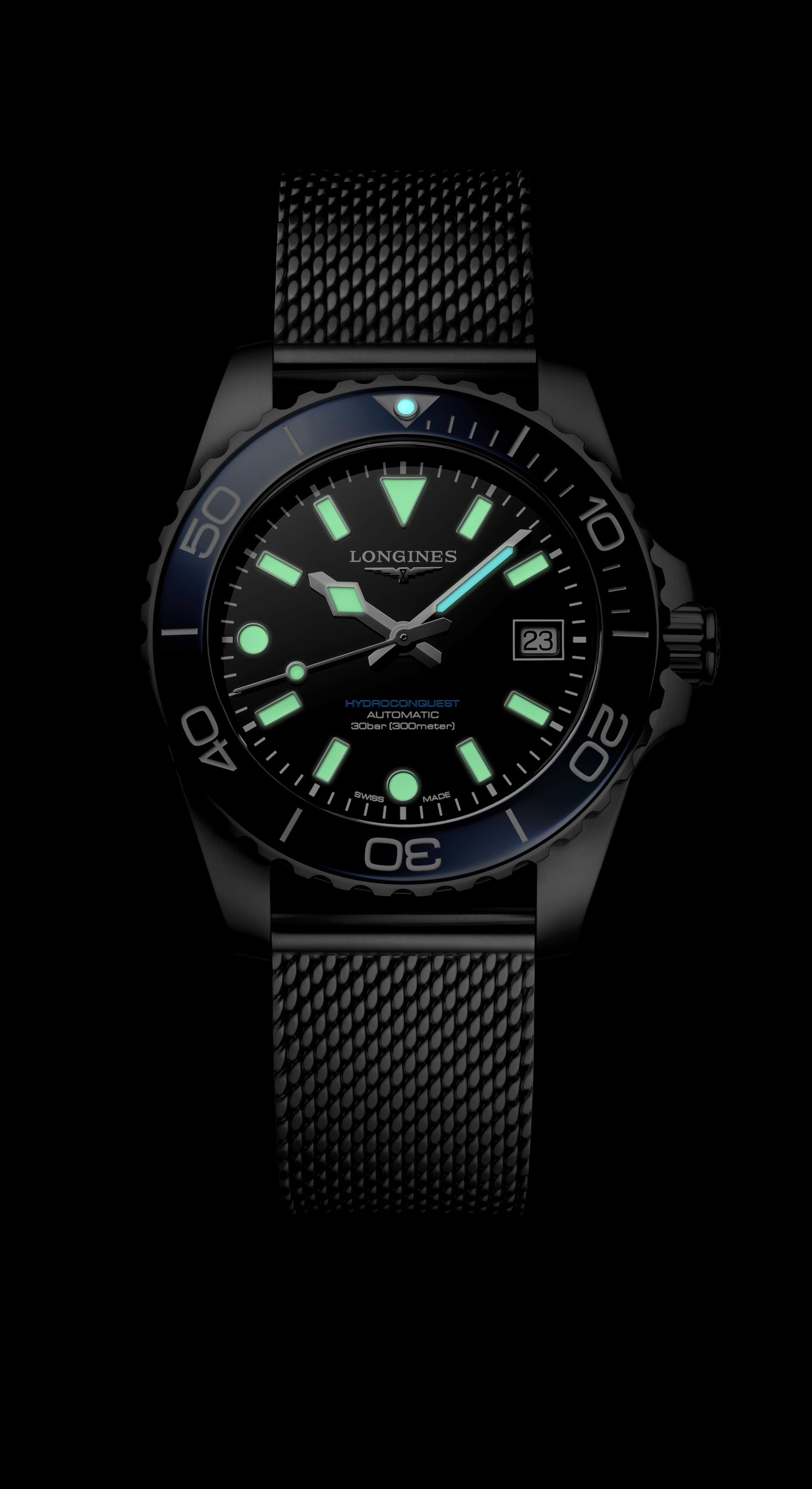 Black wristwatch with glowing face on a black background