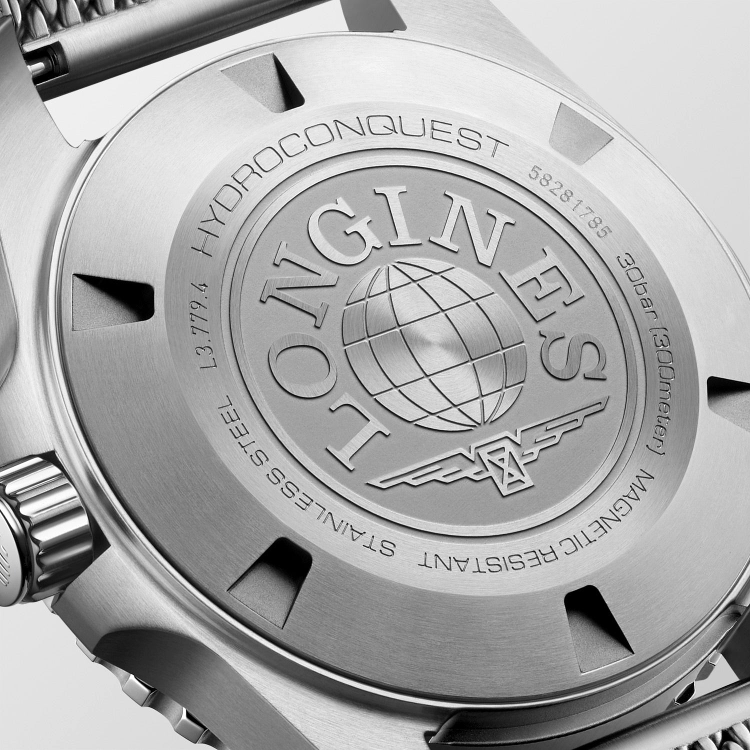 Close-up of a watch case with 'Longines' branding and details.