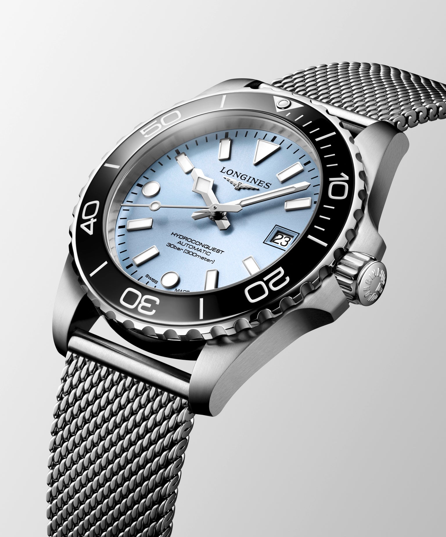 Silver watch with a detailed face on a light gray background