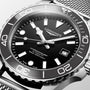 Longines watch with black dial and silver metal bracelet on a light gray background