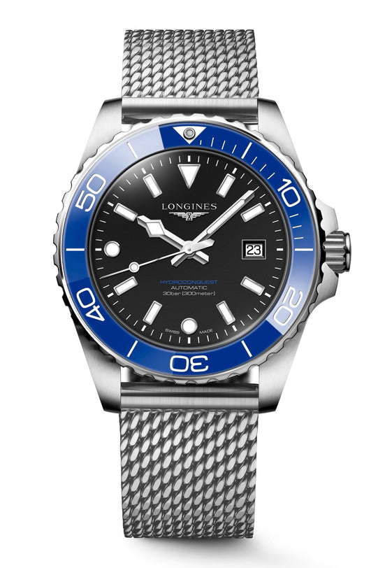 Longines watch with black dial, blue bezel, and silver mesh band on a white background