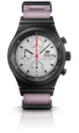 The Porsche Design Chronograph 1 F.A.T 2025 Edition features black and silver detailing, a light purple strap, and three subdials.