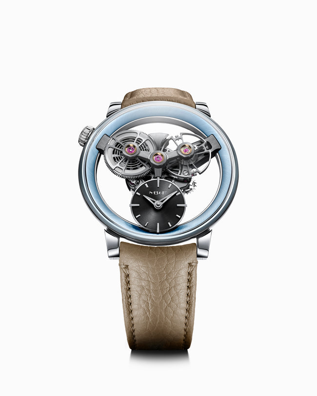 The MB&F SP One Platinum features an exposed mechanical movement and a beige leather strap, showcased on a white background.