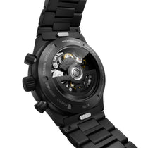 Porsche Design Chronograph 1 All Black Numbered Edition features a visible mechanical movement, titanium case back, and comes on a black metal bracelet.
