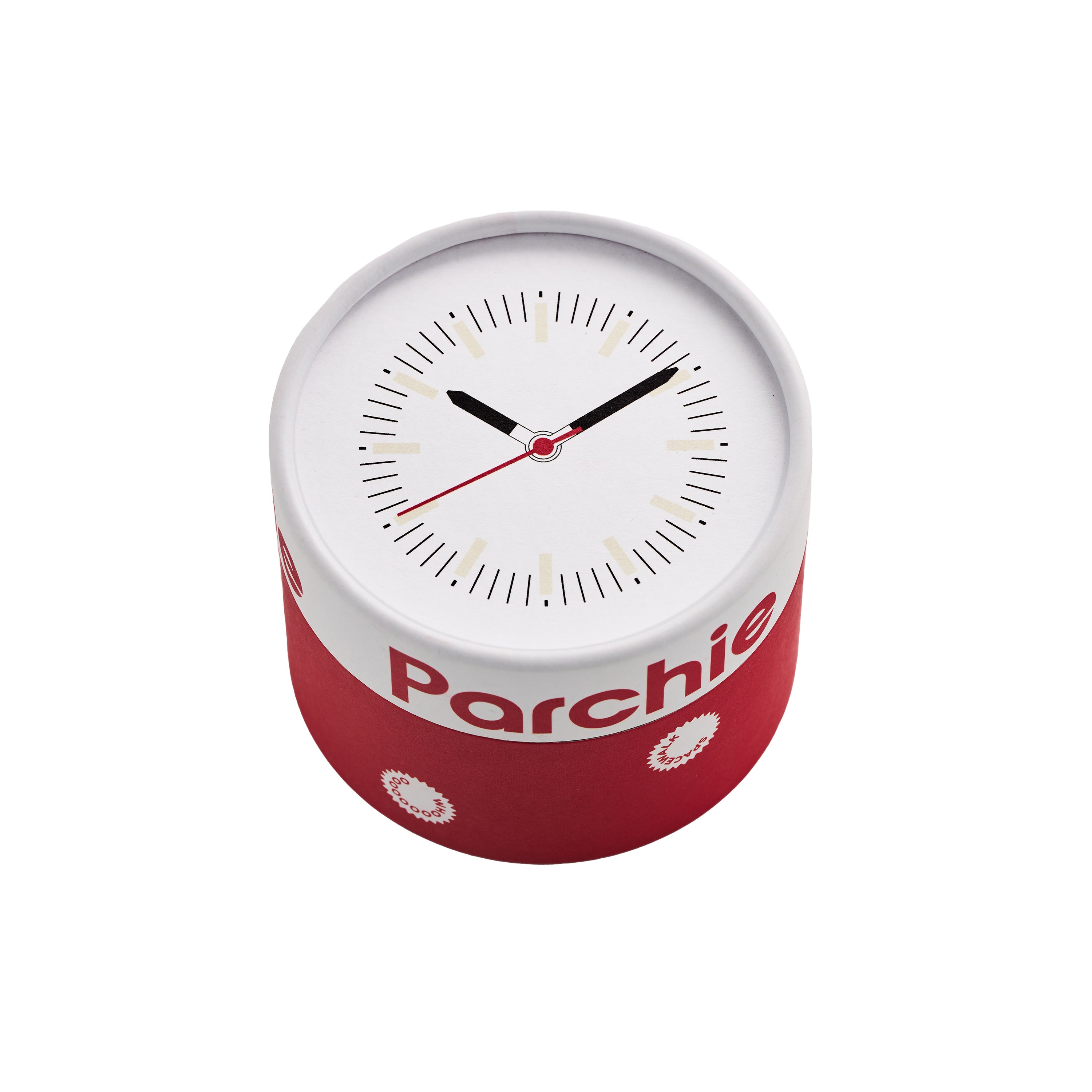 Parchie Lunar-Time Limited Editions for Hodinkee 32 clock features red sides, a white face, black hands, and ‘Parchie’ printed on the front.