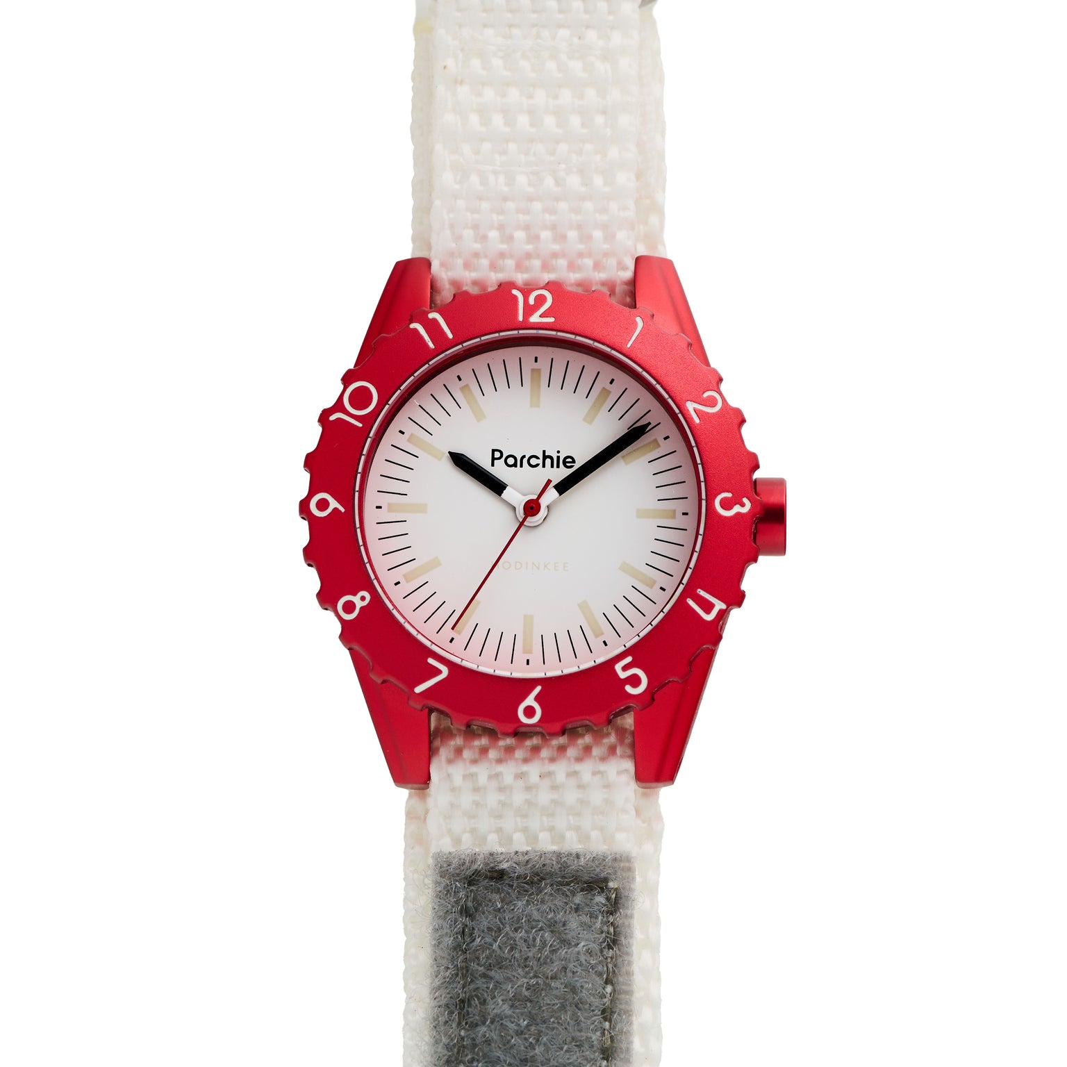 The Parchie Lunar-Time Limited Editions for Hodinkee 32 by Parchie features a red and white wristwatch with black hands, a white dial, and a white fabric strap accented by a gray patch.