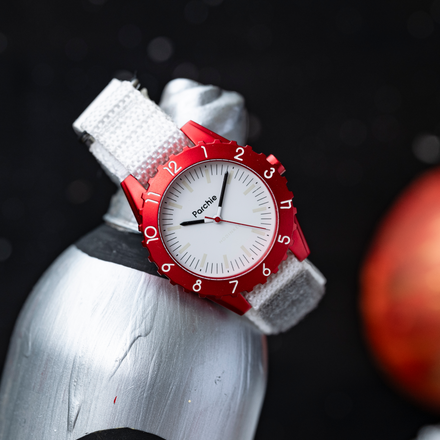 Parchie "Lunar-Time" Limited Edition 36mm watch exclusive for Hodinkee modeled atop a silver water bottle