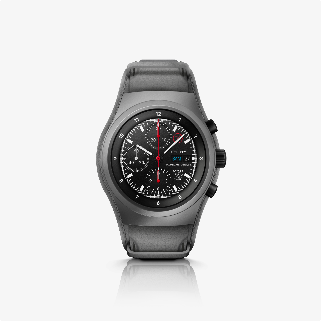 The Porsche Design Chronograph 1 Utility Limited Edition is a black and gray round-faced chronograph wristwatch with a black strap, displayed on a white background.