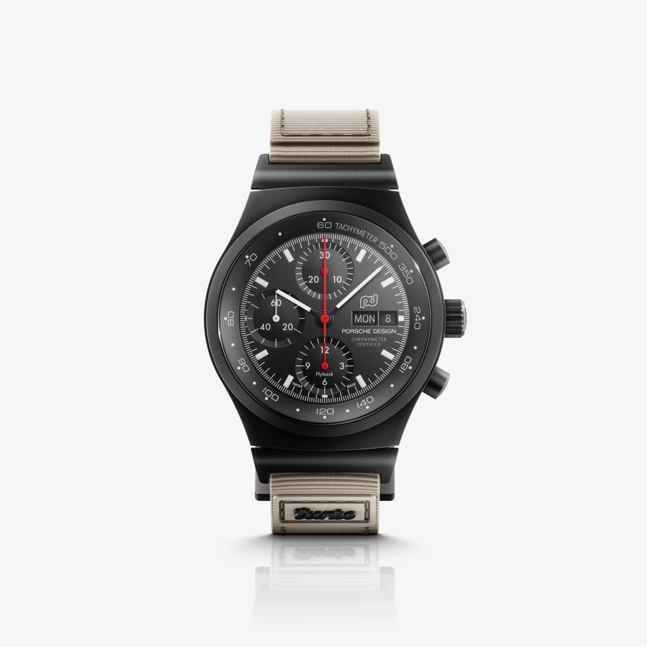 The Porsche Design Chronograph 1 50 Years 911 Turbo Edition features a black dial with red accents, a black bezel, and a beige fabric strap.