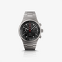 The Porsche Design Chronograph 1 1975 Limited Edition is a stainless steel chronograph watch with a black dial and three subdials, shown on a white background.