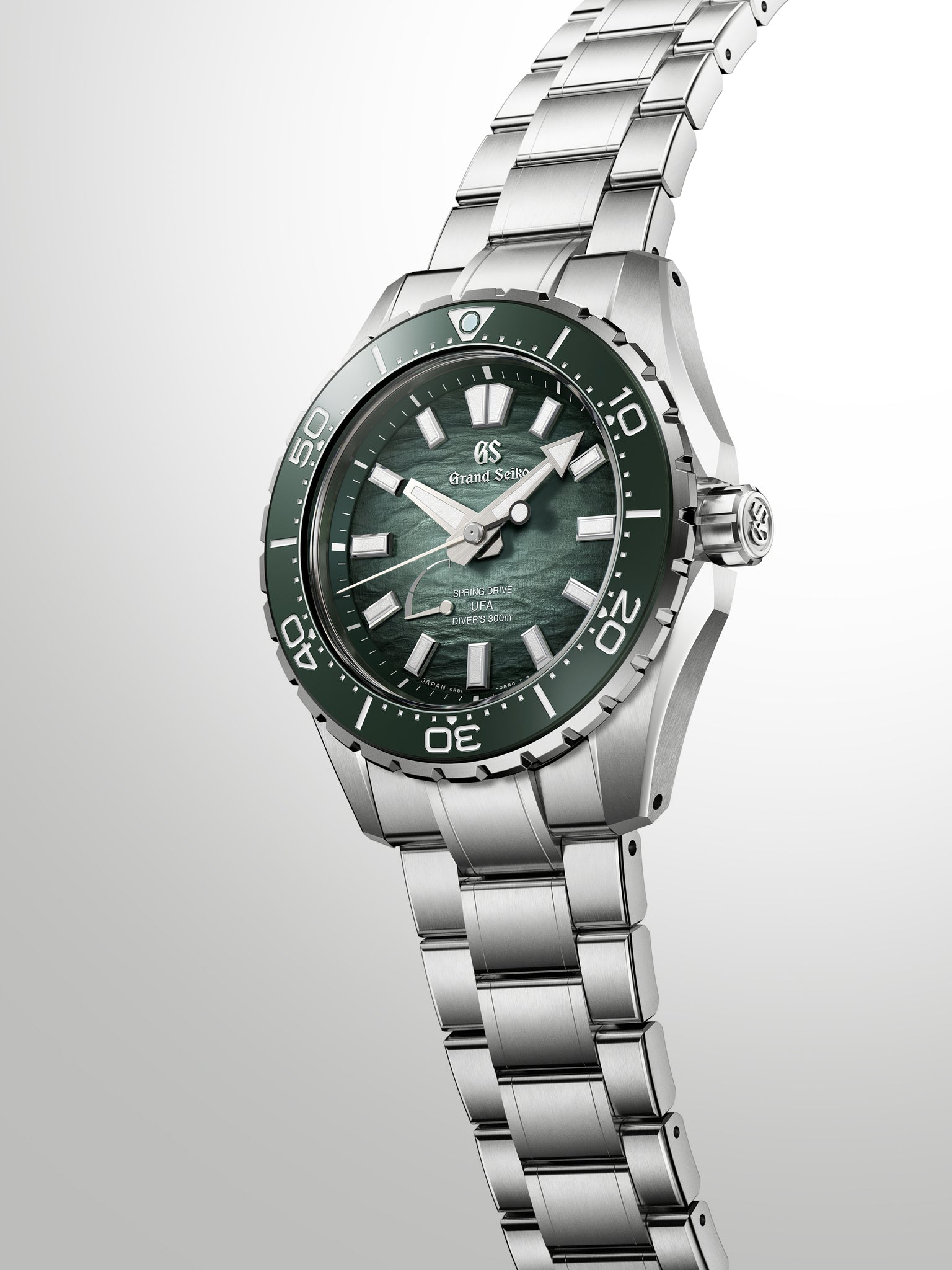 Grand Seiko Spring Drive diver watch with green sunburst dial, stainless steel case and bracelet, rotating bezel marked to 70