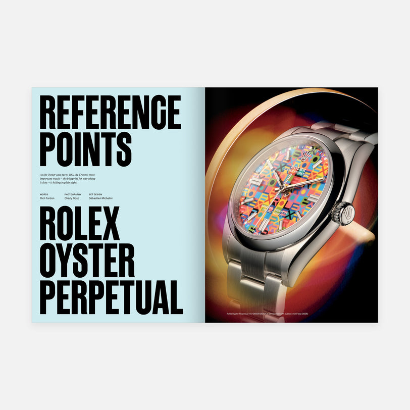Rolex Oyster Perpetual watch with colorful face on a magazine cover