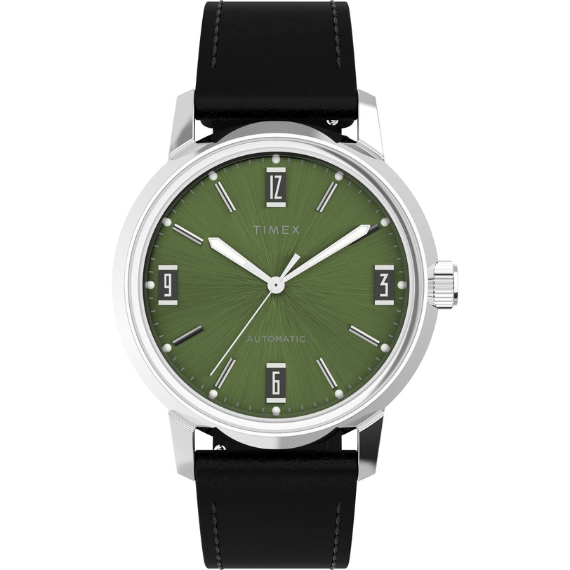 The Timex Marlin® Automatic features a green sunburst dial with silver markers, black rectangular hour indicators, a black leather strap, and domed acrylic crystal on a silver case, inspired by the 1960s Marlin design.