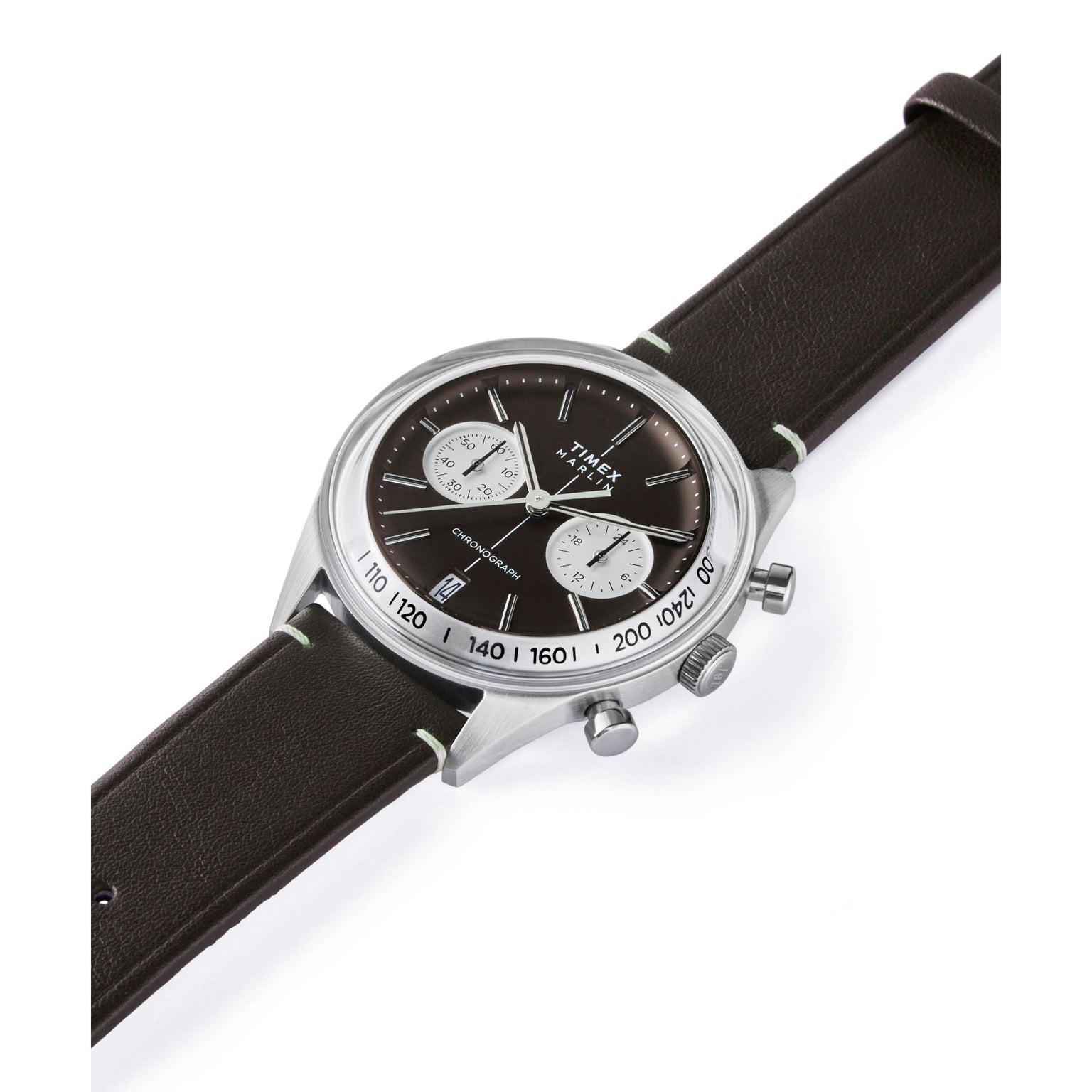 A Timex G SS QZ SW JET 40 BROWN DL BWN STP 25 watch with a silver case, black face, domed Hesalite crystal, two white subdials, chronograph and date display, and a dark brown leather strap is shown angled on a white background.