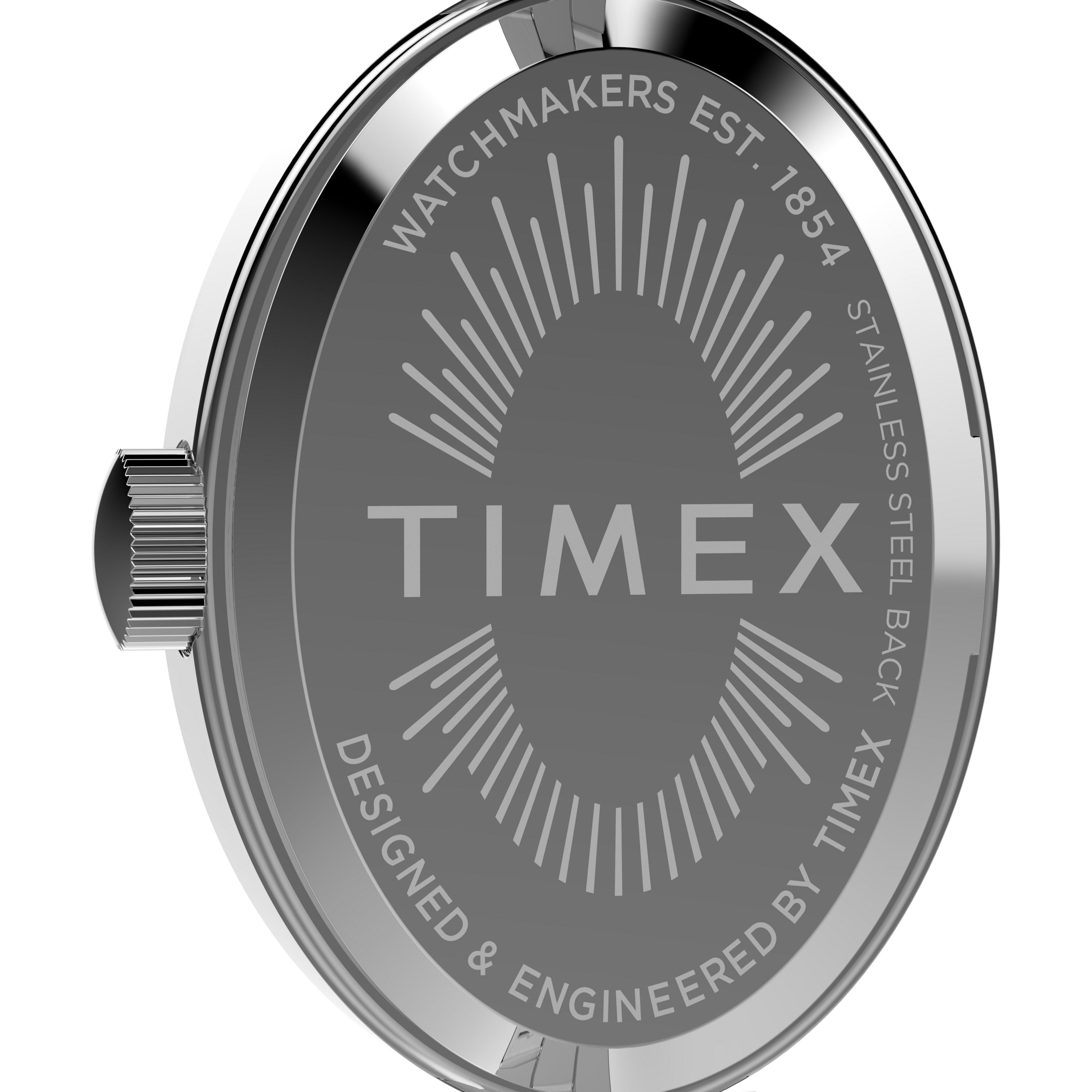 The image shows the stainless steel back of the Timex Cavatina Silver-tone Case and Bracelet with Aquamarine Dial, engraved with the logo and sunburst design—a classic watch known for its elegant oval case and refined details.