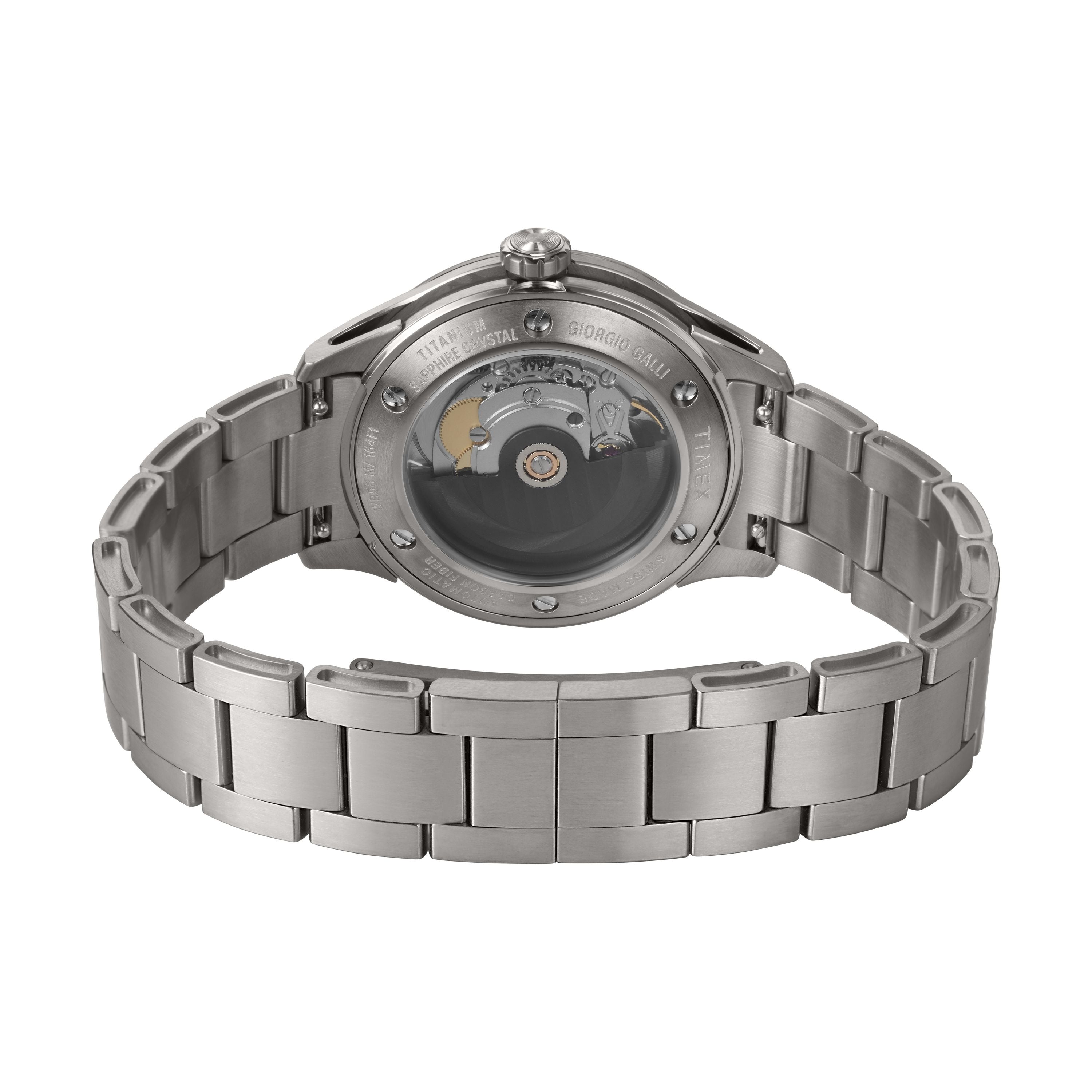 The image displays the back of the Timex Giorgio Galli S2Ti Automatic, featuring a silver metal band and a transparent sapphire crystal caseback that reveals its internal mechanical movement. The metal strap is open and laid out.