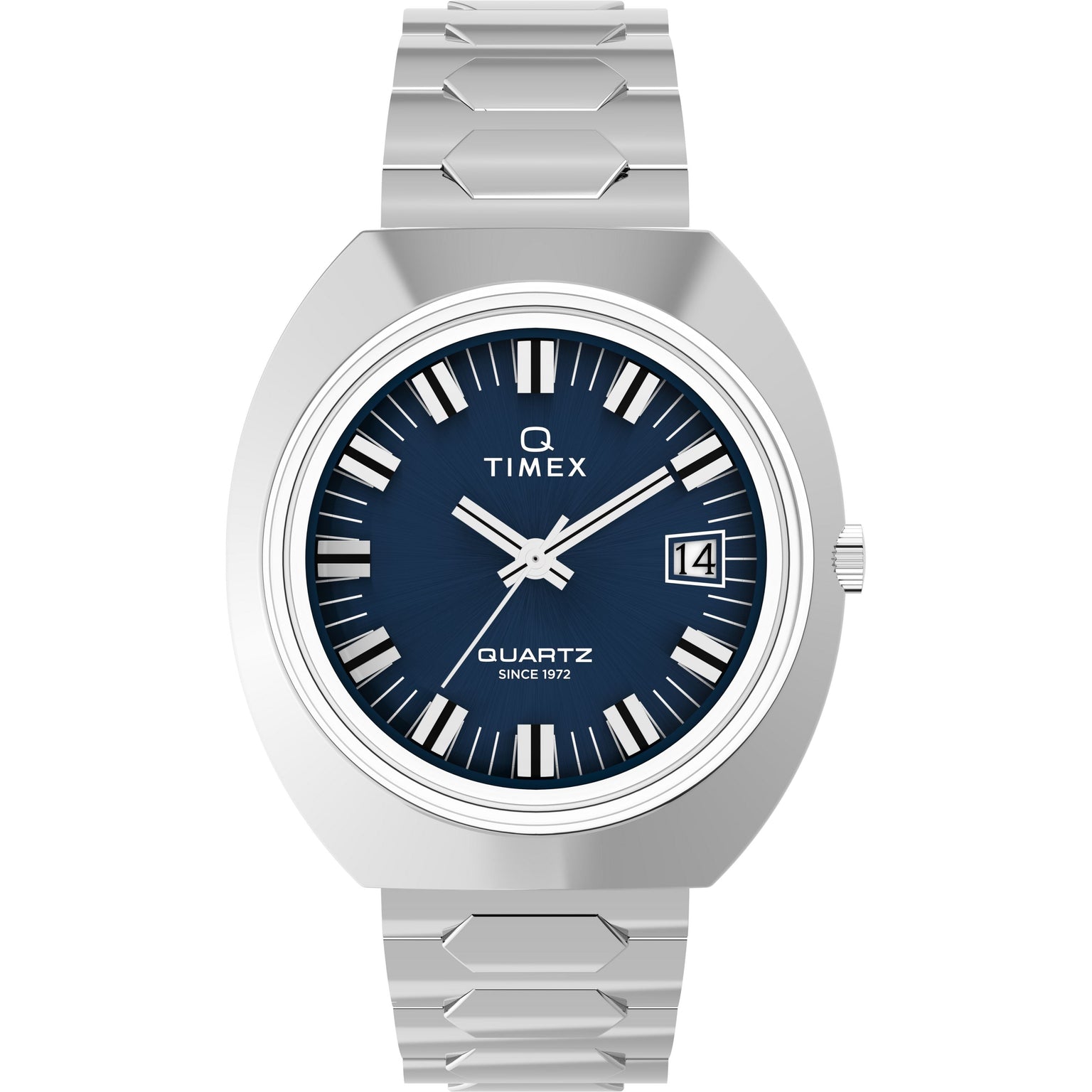The Timex Q 1972 Time Machine Reissue is a silver watch with a blue face, bold white hour markers, silver hands, date window at 3 o’clock, geometric bracelet, archival quartz movement, and "Quartz Since 1972" on the dial.