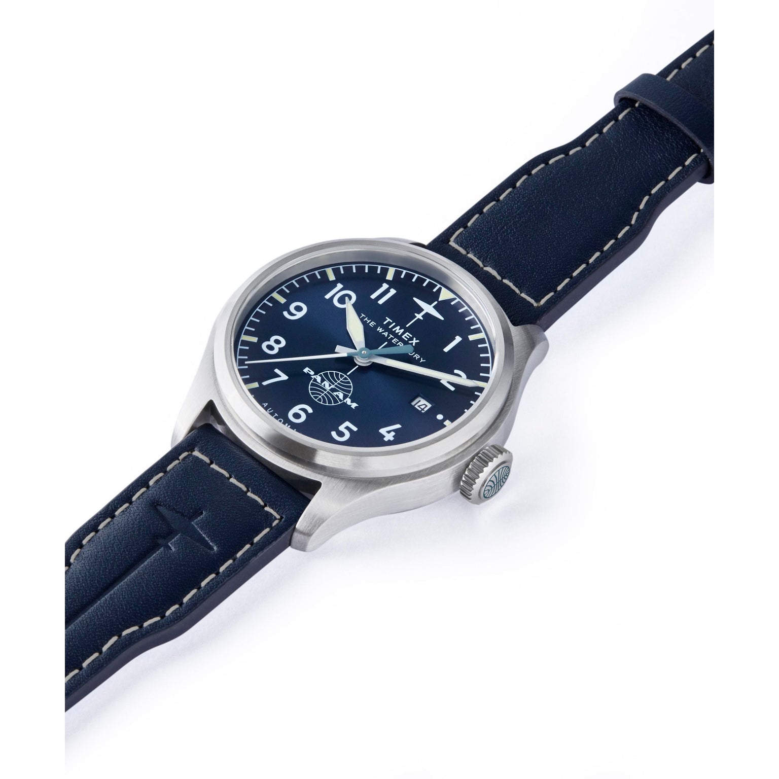 The Timex x Pan Am® Waterbury Automatic Ace features a silver case, blue face with white numerals, and a blue leather strap with white stitching, shown angled on a white background.