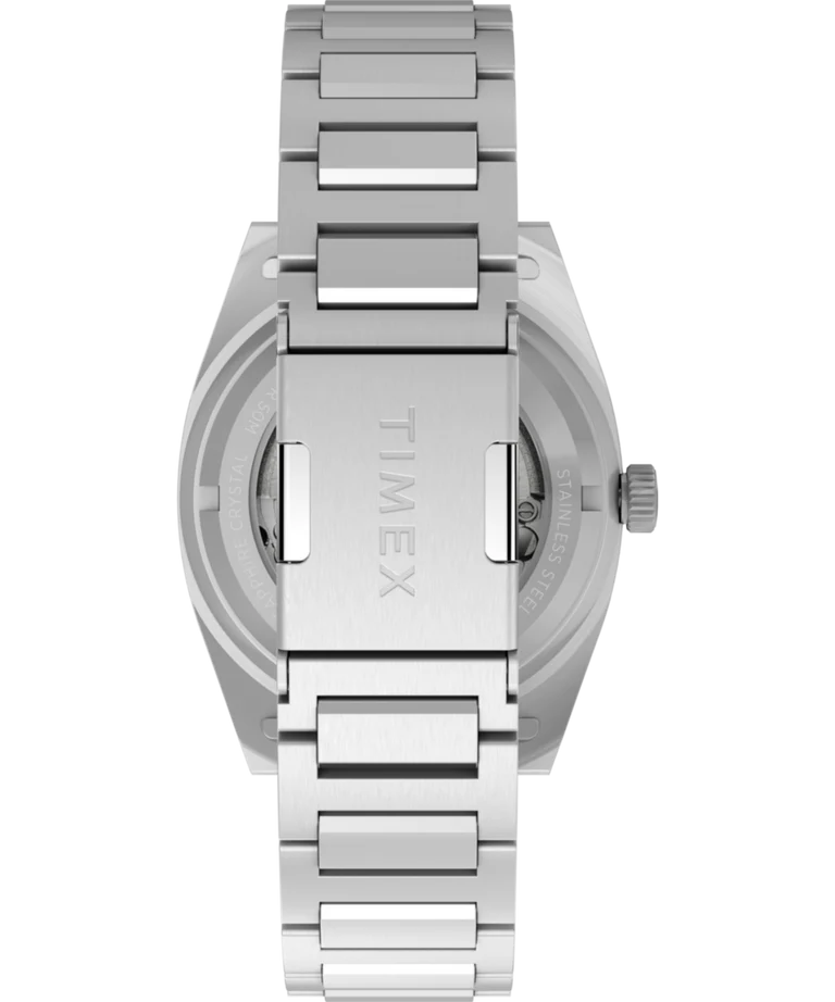 A close-up of the back of a stainless-steel Timex Expedition® Capstone Automatic watch shows the engraved Timex clasp and its Japanese automatic movement.