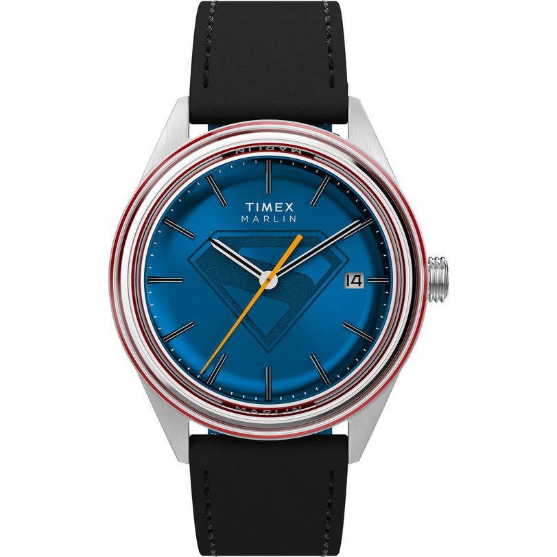 The Timex x Superman Marlin® Jet Automatic features automatic movement, a black strap, blue dial with subtle Superman logo, silver-tone case, red bezel accents, and a date window at 3 o’clock.