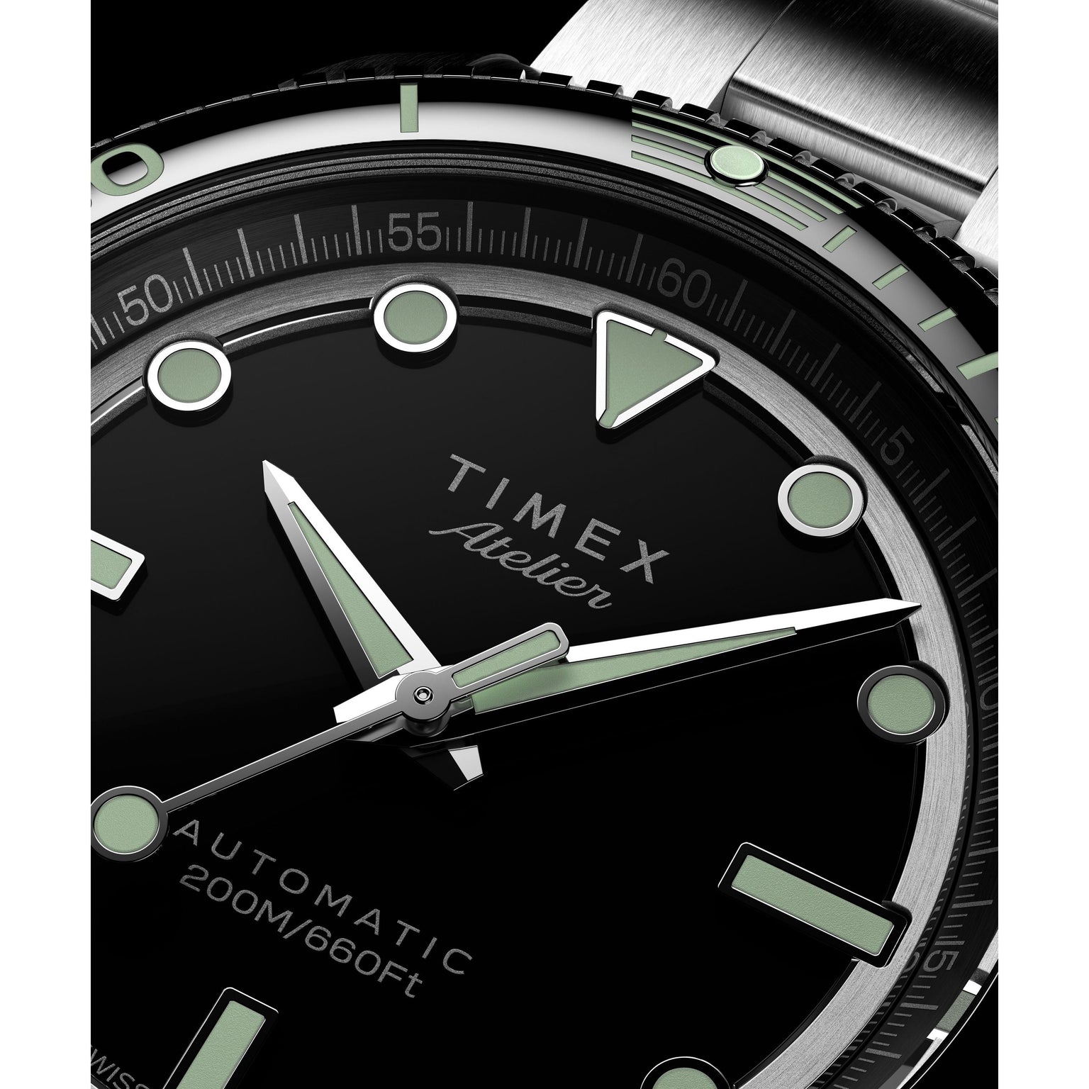 Close-up of the Timex Atelier Marine M1a Swiss Made Automatic, highlighting its black dial, luminous hands and markers, silver bezel, 200M/660Ft water resistance—blending precise details and minimalist design in a modern tool watch.